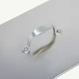 A sleek, metallic case handle is mounted on a flat surface with two visible screws.