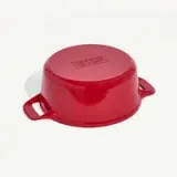 A red round saucepan with two handles and a lid on a white background.