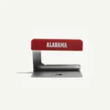 A metal and red plastic kitchen tool with "ALABAMA" printed on the handle.