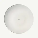 A plain white circular plate is centered on a white background.