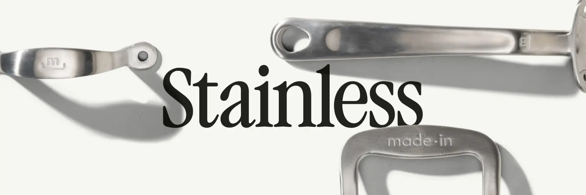 Three stainless steel kitchen utensils are displayed alongside the word "Stainless" and the phrase "made-in."