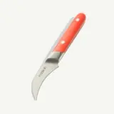 A curved blade with a red handle lies against a light background, possibly a type of kitchen knife.