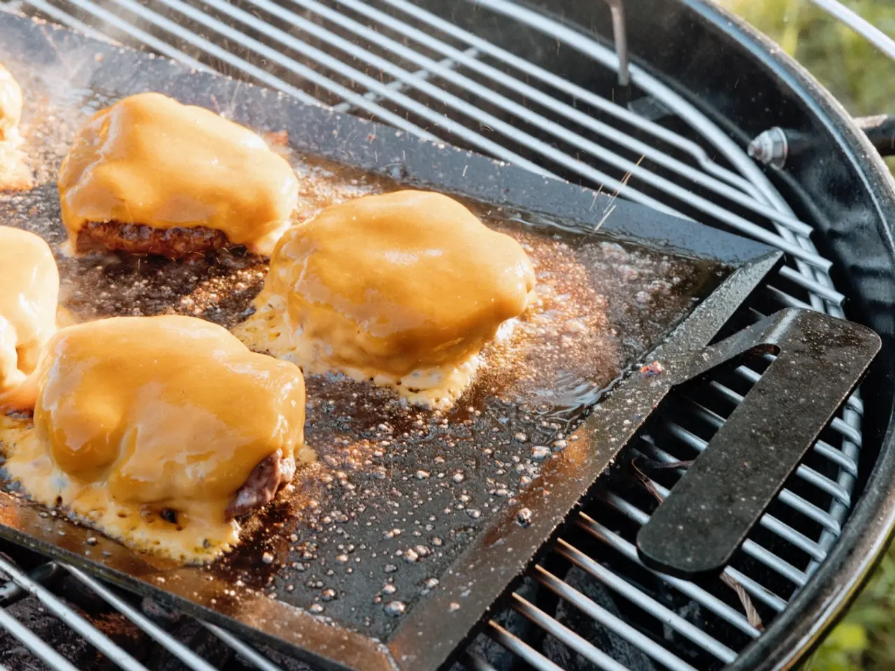 cheeseburgers on griddle