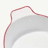 A white ceramic bowl with a red rim and the word "madein" embossed on the edge is presented on a white background.