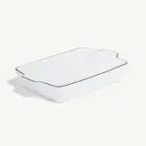 A simple white rectangular ceramic baking dish on a plain background.