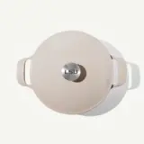 A light-colored cooking pot with a glossy finish and an "LSU" emblem on the lid.