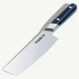 A chef's knife with the brand name "made•in" printed on the blade and a dark handle.
