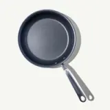 A non-stick frying pan with a metal handle is shown against a light background.