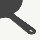 A black, round frying pan with a long handle is shown.