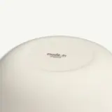 A close-up view of the bottom of a white bowl with "made in England" printed.