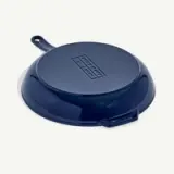 A blue, upside-down frying pan with a handle and a small rectangular logo in the center.