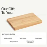 A wooden butcher block made from maple, featuring a two-sided, edge-grain design and labeled "MADE IN USA."