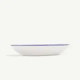 A white ceramic plate with a blue rim is displayed on a plain background.