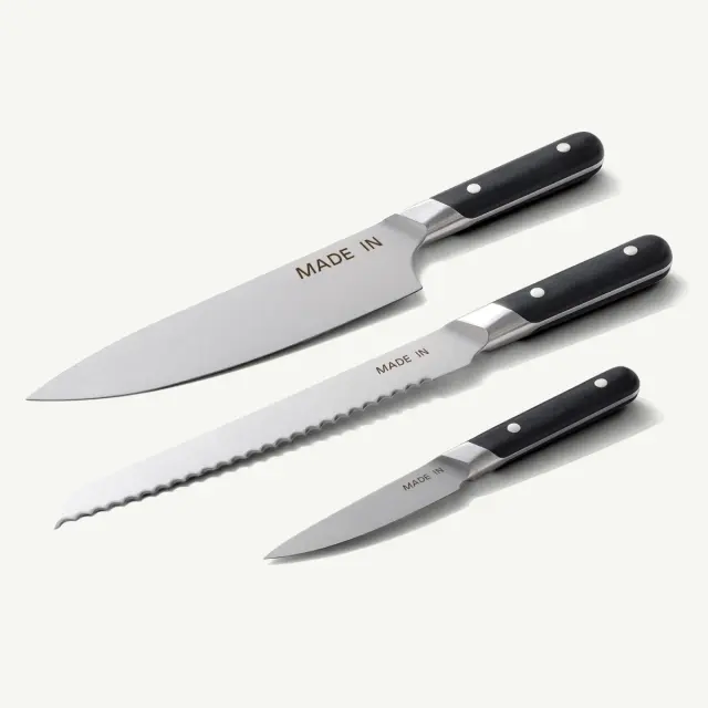 Three kitchen knives with black handles and stainless steel blades, featuring the engraving "MADE IN."