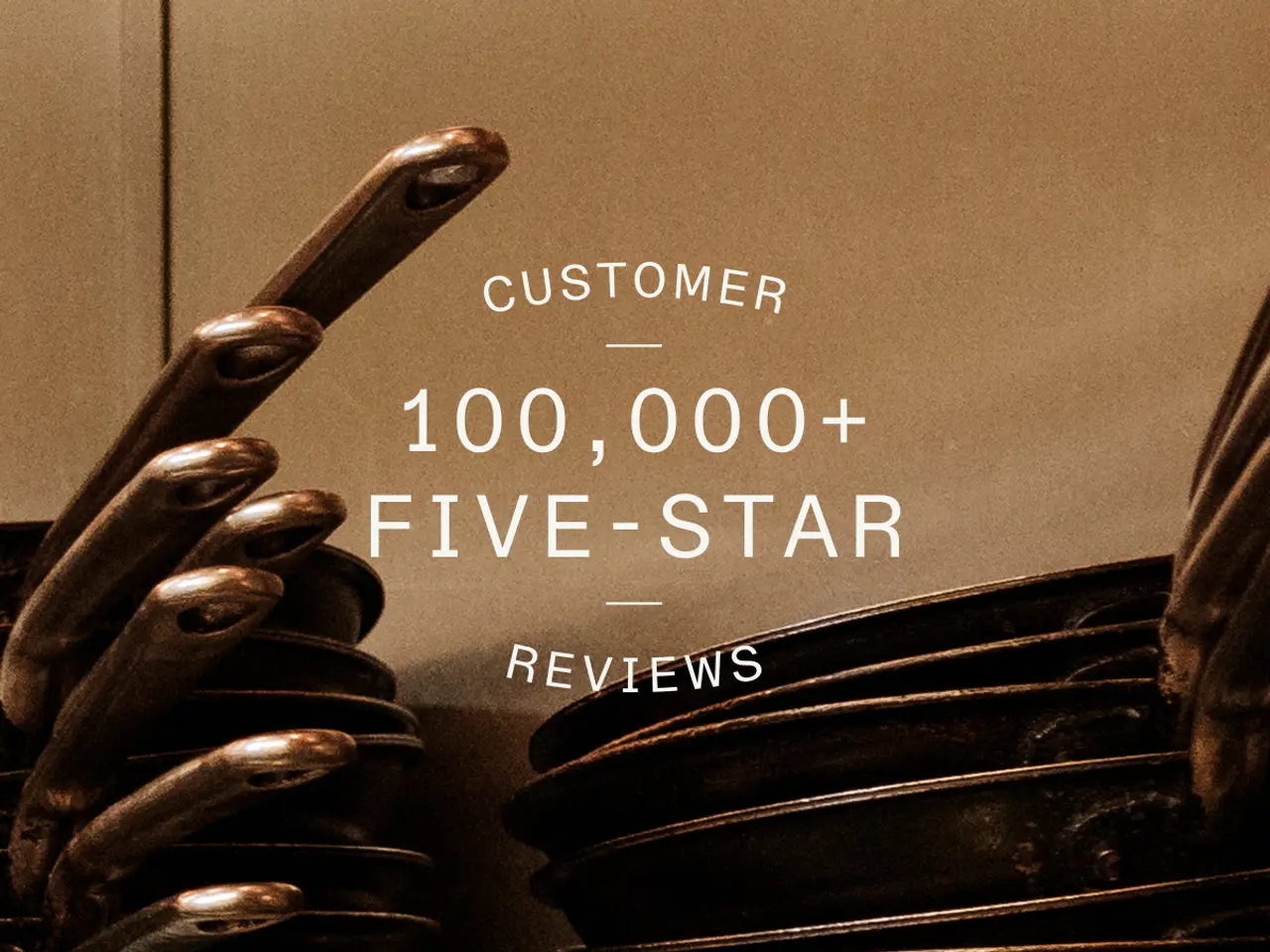 A display boasts over 100,000 five-star customer reviews above a collection of stacked cooking pans.