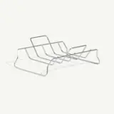 A wire rack designed to hold lids of various sizes stands on a light background.