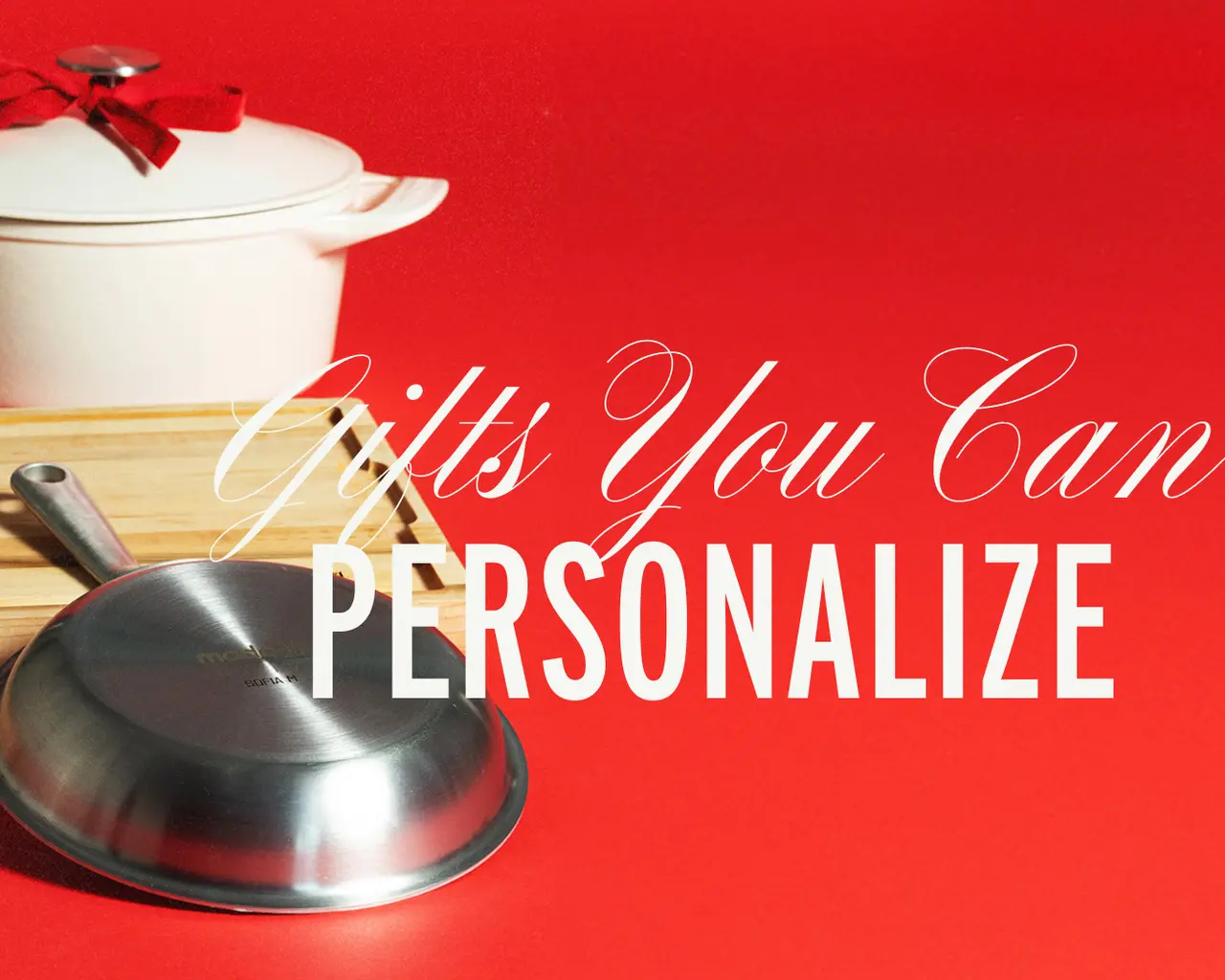 A white pot and a metal strainer are displayed on a wooden tray against a red background, highlighting the phrase "Gifts You Can PERSONALIZE."