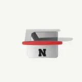 A silver device with a red handle features a prominent black "N" logo on the front.