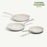 Three non-stick frying pans of varying sizes, featuring a light-colored interior and metal handles, are displayed alongside a "5 Leaf Rated" sustainability badge.