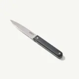 A sleek paring knife with a black handle and a silver blade is displayed on a light background.