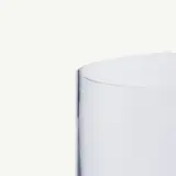 A clear, cylindrical glass vase with a smooth surface and no decorations.