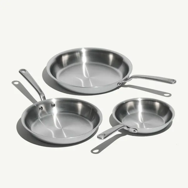 Three stainless steel frying pans in different sizes from Made In’s Stainless Clad Frying Pan Set.