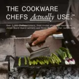 A hand holding a stainless steel tool is shown above a grill with fresh asparagus and green onions, accompanied by text promoting cookware used by professional chefs.