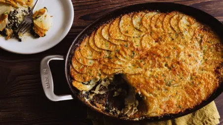 A golden potato gratin bakes in a Made In Oval Gratin Pan beside a plated serving.