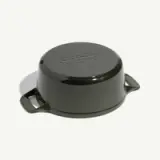 A dark green, round cooking pot with handles and a flat lid on top.