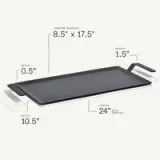 A rectangular griddle with dimensions of 24 inches in length (including handles), 10.5 inches in width, and a cooking surface measuring 8.5 inches by 17.5 inches, featuring a height of 1.5 inches and a depth of 0.5 inches.