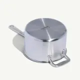 A stainless steel saucepan with a side handle is shown upside down on a white background.