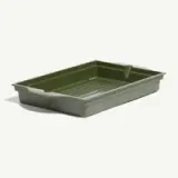A green plastic tray with ridged bottom and two handles.