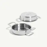 A stainless steel frying pan with a matching lid, featuring two side handles.
