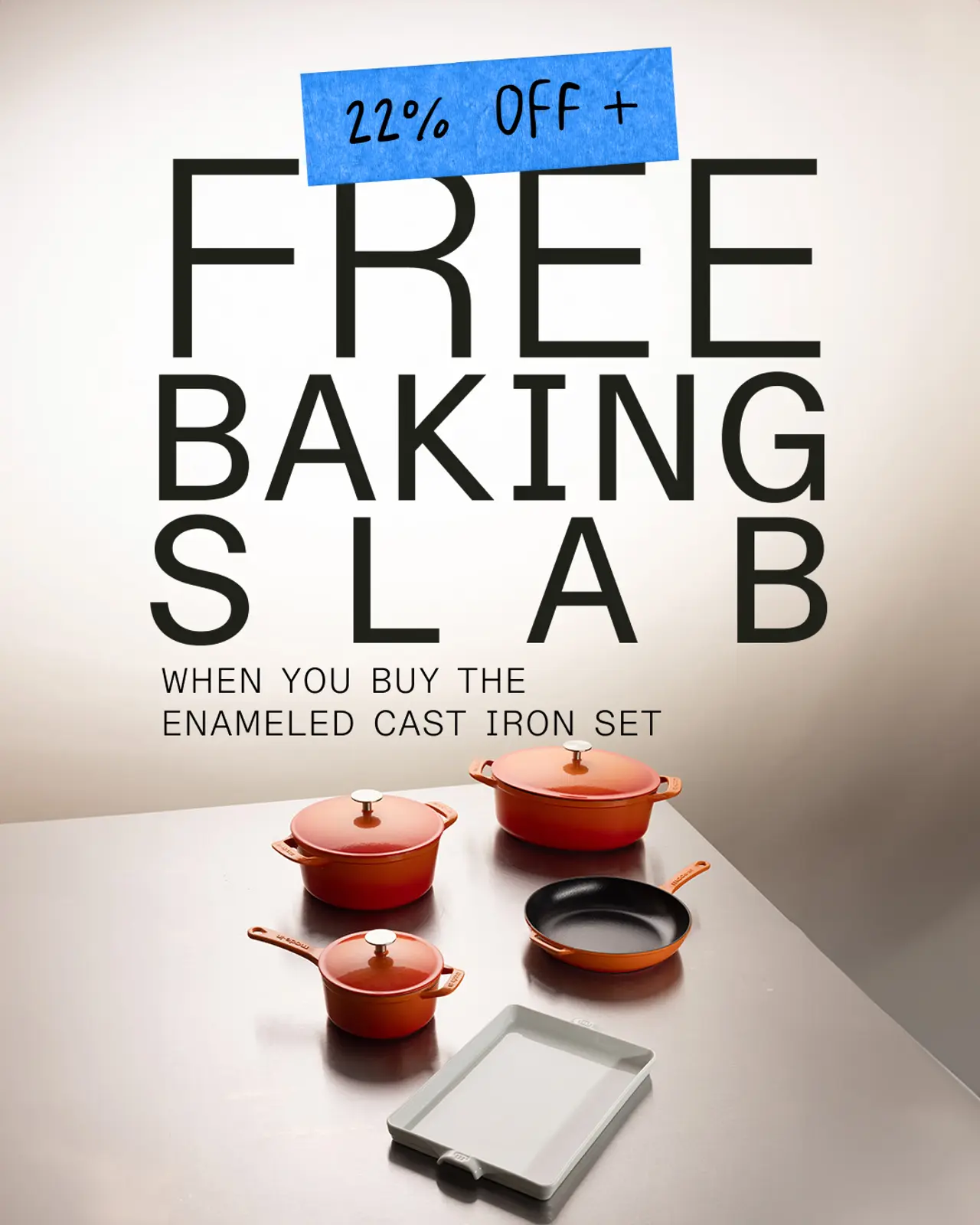 An advertisement offers a free baking slab and 22% off on an enameled cast iron cookware set displayed with pots, pans, and a lid on a gradient background.