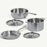 A set of stainless steel cookware, including a saucepan, a sauté pan, and their respective lids.