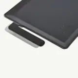 A rectangular black metal product with a built-in handle and a minimalist design.