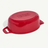 A red, oval-shaped enameled cast iron lid with handles on both sides.