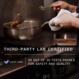 A person is cooking in a kitchen with a label stating "Third-Party Lab Certified: 30 out of 30 tests passed for safety and quality."