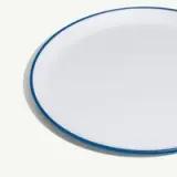 A round white plate with a blue rim.