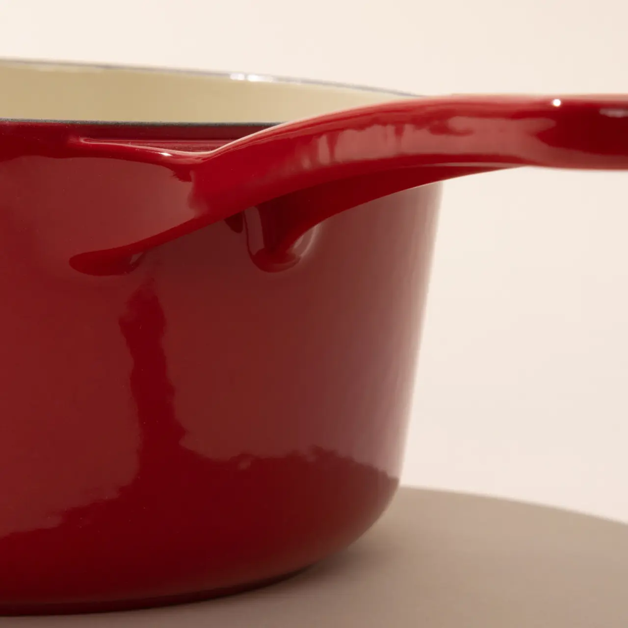enameled cast iron saucepan made in red handle detail