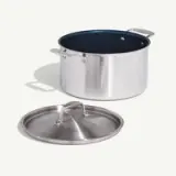 A stainless steel pot with a detached lid is shown against a plain white background.