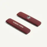 Two maroon hair barrettes featuring the text "FLORIDA STATE" and a logo of a Native American profile.