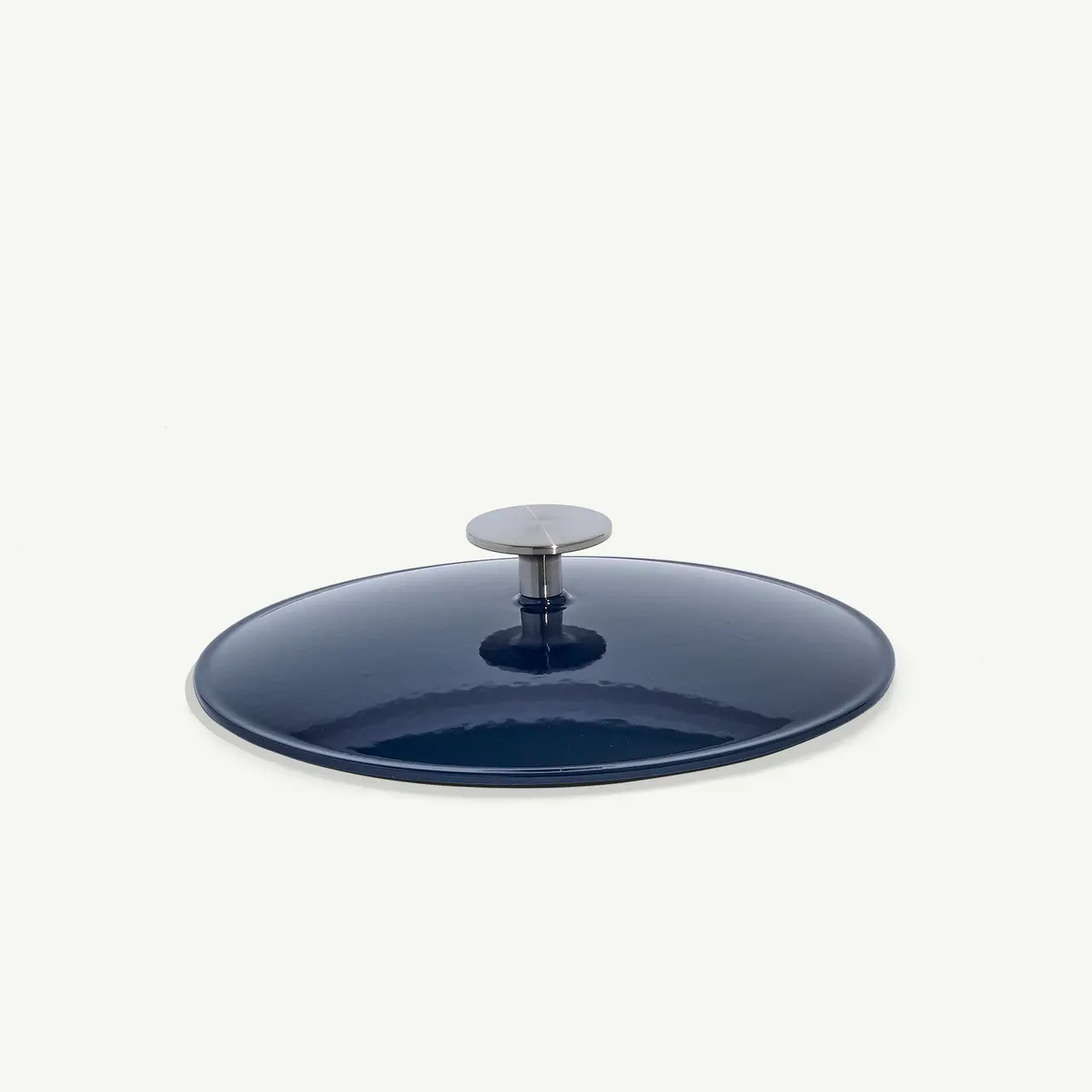 A blue cooking pot lid with a metal handle is shown against a plain background.