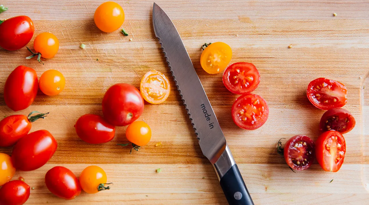 utility knife cutting cherry tomatoes