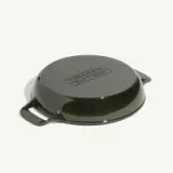 A round, dark green cast iron cooking dish with two handles and an embossed label indicating it was made in France.