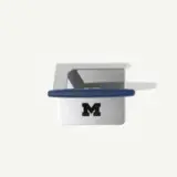 A silver and blue item with a prominent "M" logo, likely representing a university or sports team.