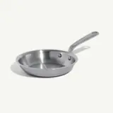 A stainless steel frying pan with a long handle is shown against a white background.