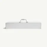 A rectangular metal box with a handle on top sits against a plain background.