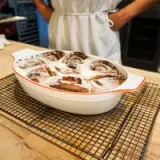 oval baking dish red rim lifestyle