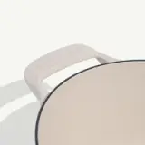 A beige cast iron skillet with a handle is shown from a slightly angled top view.